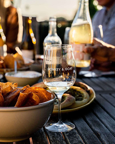 People enjoying Donkey & Goat wine with meal