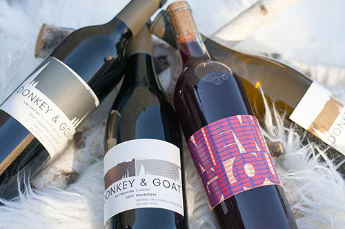 Bottles of Donkey & Goat wine on white faux fur