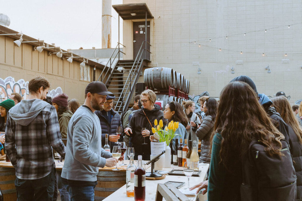 people enjoying our backyard during first friday block party