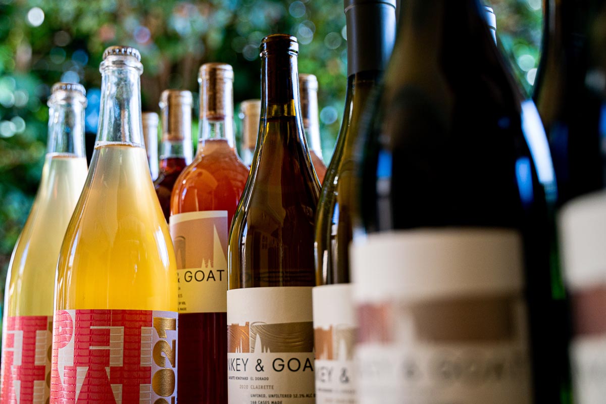 bottles of donkey & goat wine nestled closely together 