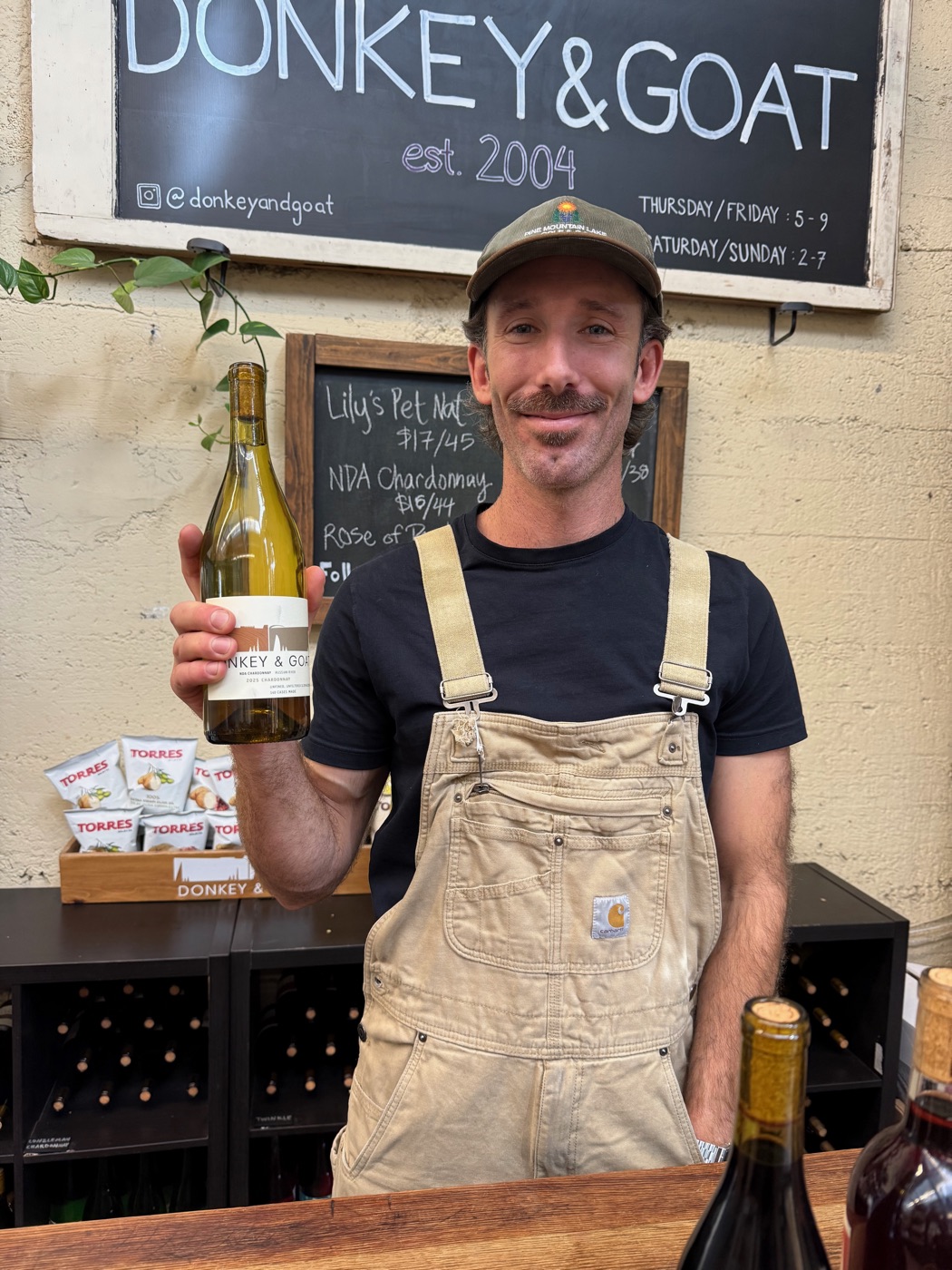 Winemaker Michael McCullough pouring a glass